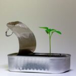 Start-up - silver steel flower pot on white table
