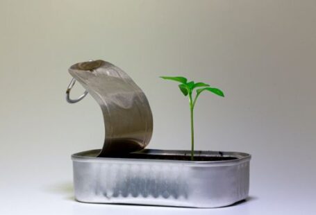 Start-up - silver steel flower pot on white table