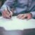 Legal Protection - man writing on paper